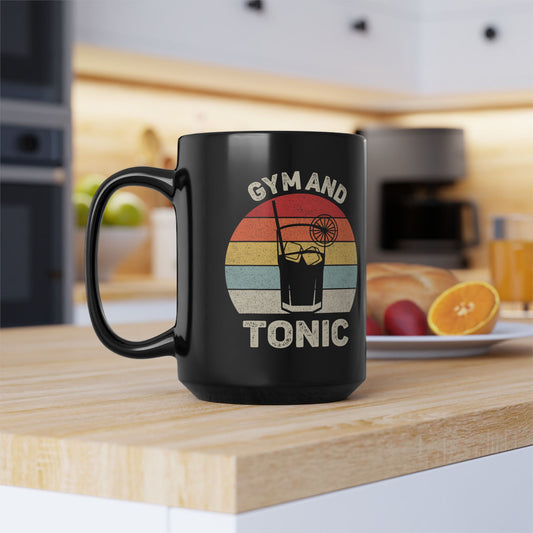 Black mug with 'Gym and Tonic' design on a kitchen counter