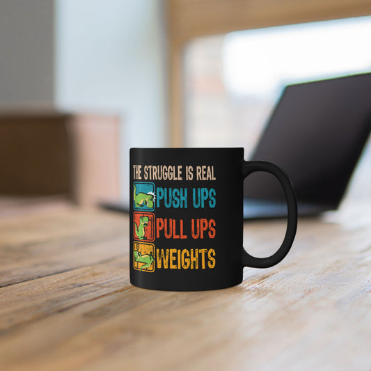 Person holding a mug with a dinosaur The Struggle Is Real sarcastic gym graphic.