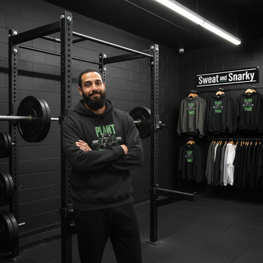 Man standing in a gym with fitness equipment and clothing on display.
