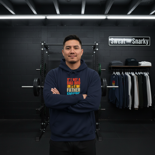Man wearing a navy hoodie with colorful text in a gym setting