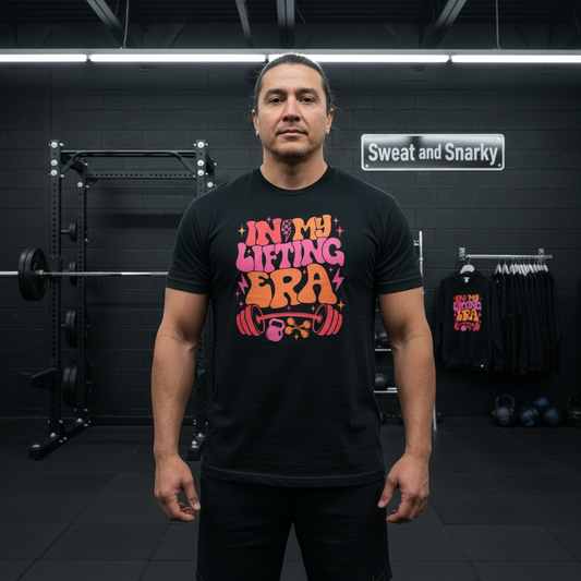 Man wearing a black t-shirt with colorful text in a gym setting