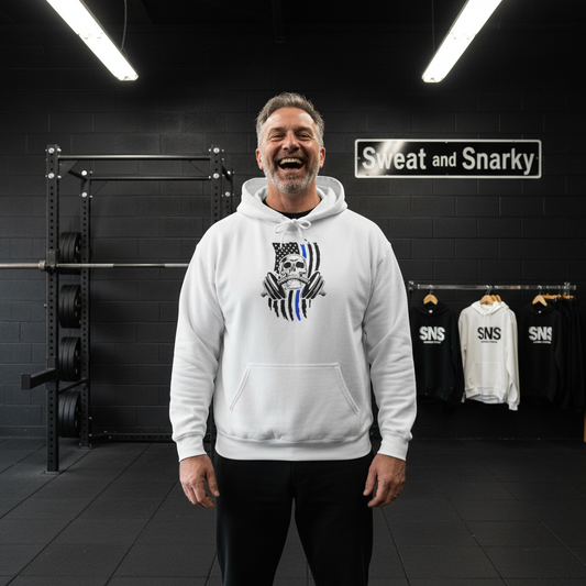 Man wearing a white hoodie with a logo in a gym setting, with 'Sweat and Snarky' branding visible.