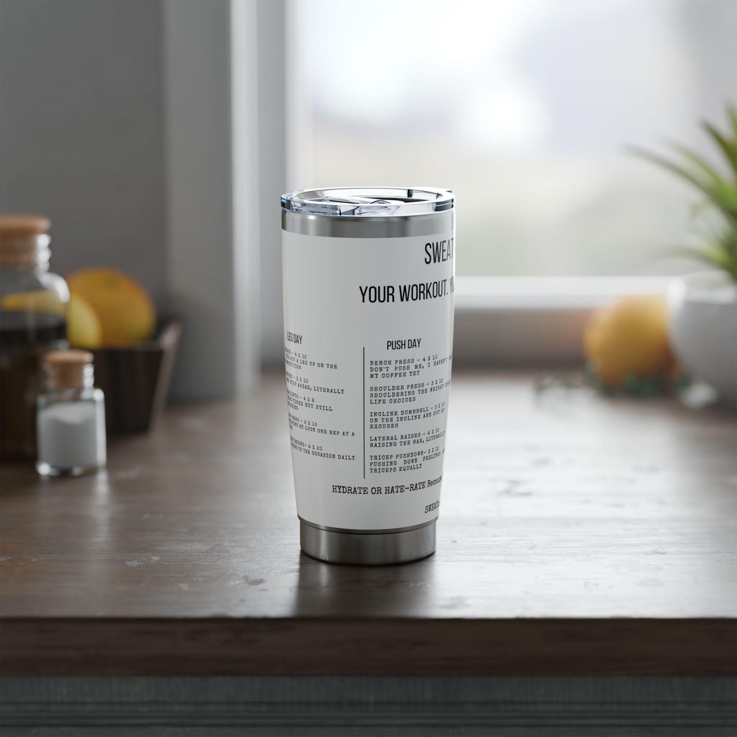Tumbler with text on a wooden surface with a blurred background